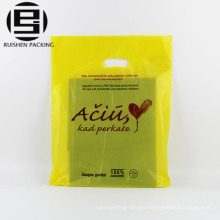 Yellow print biodegradable die cut handle bags